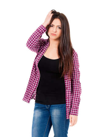 Concept of problems and headache. Girl puts hands on the head, isolated on white.の写真素材