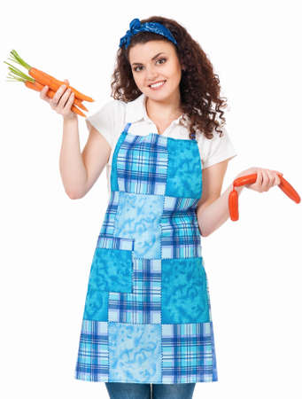 Young housewife with sausage and fresh carrots, isolated on white backgroundの写真素材