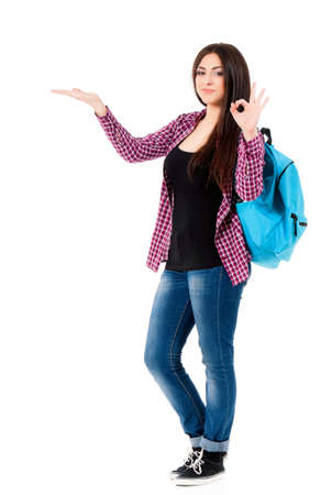 Beautiful student girl with backpack, isolated on white backgroundの写真素材