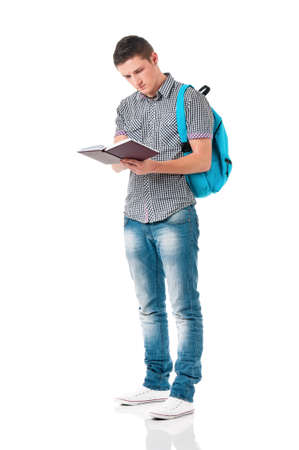 Boy student with backpack and notepad, isolated on white backgroundの写真素材