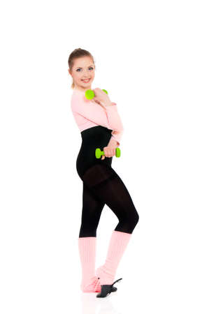 Full body of happy young woman in fitness wear exercising with dumbbells, isolated on white backgroundの写真素材