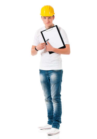Young foreman with hard hat, showing blank clipboard, isolated on white backgroundの写真素材