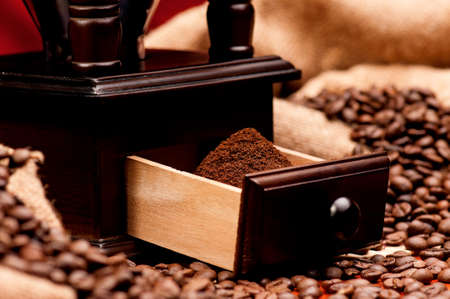 Manual coffee grinder with coffee beans - close upの写真素材