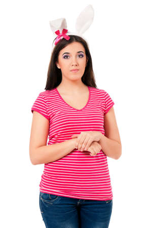 Portrait of teen girl with white rabbit ears, isolated on white backgroundの写真素材