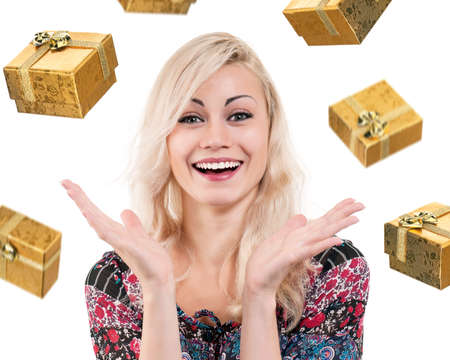 Beautiful blonde woman catching falling gifts, isolated on white backgroundの写真素材