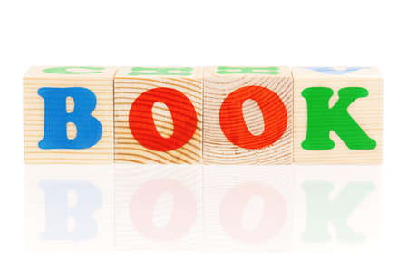 Wooden blocks arranged in the word BOOK - isolated on white backgroundの写真素材