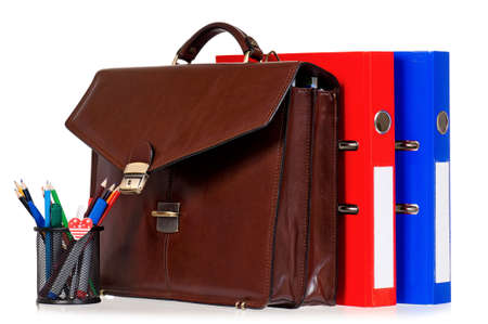 Brown leather briefcase with office accessories, isolated on white backgroundの写真素材