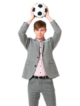 Young man in suit with soccer ball, isolated on white backgroundの写真素材