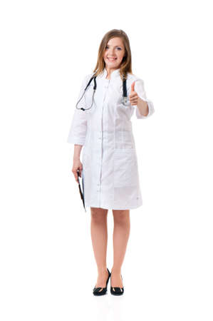 Cheerful medical doctor woman with stethoscope showing thumbs up sign, isolated on white backgroundの写真素材