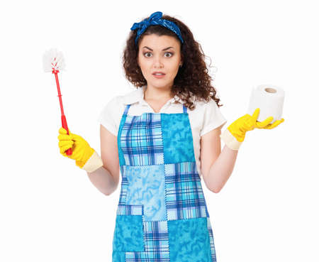 Young housewife with yellow gloves, toilet brush and paper, isolated on white backgroundの写真素材
