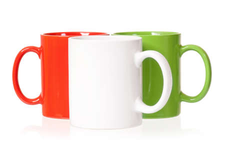 Colorful cups for coffee or tea, isolated on white backgroundの写真素材
