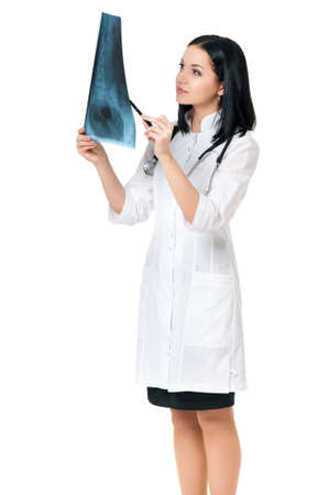 Female doctor examining an x-ray picture on white backgroundの写真素材