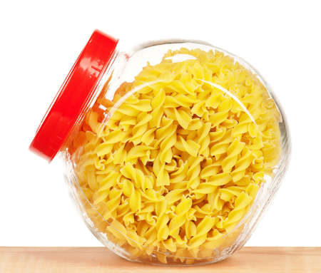 Pasta in glass pot isolated on white backgroundの写真素材
