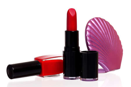 Set of cosmetics - nail polish, small mirror and lipstick isolated on white backgroundの写真素材