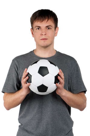 Portrait of a man standing with classic soccer ball on isolated white backgroundの写真素材