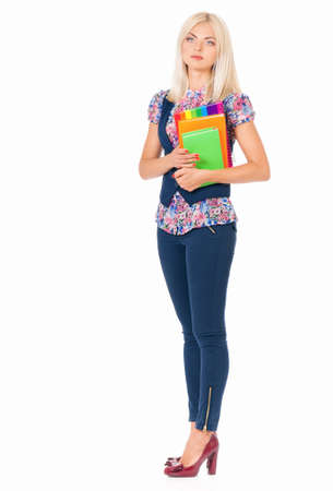 Full body portrait of young business woman with books, isolated on white backgroundの写真素材