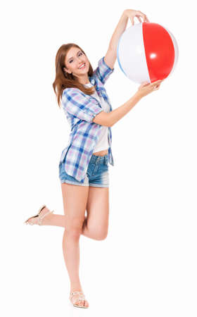 Pretty girl with beach ball, isolated on white backgroundの写真素材