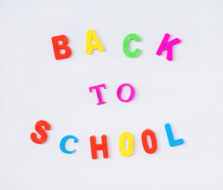 Colorful back to school alphabet letters on whiteboard