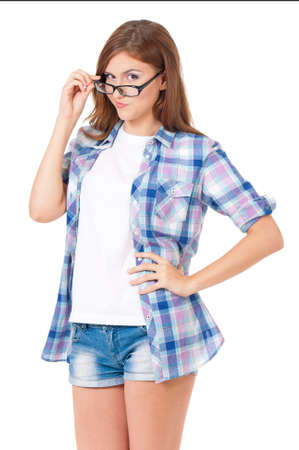 Portrait of happy smiling teen girl with glasses, isolated on white backgroundの写真素材