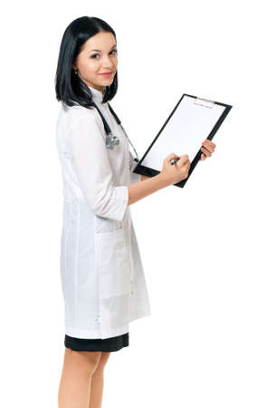 Beautiful female doctor holding clipboard, isolated on white backgroundの写真素材