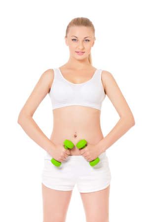 Woman exercising with dumbbells, portrait isolated over white backgroundの写真素材