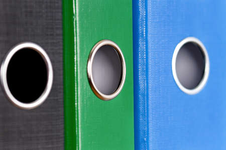 Multicolor office folders file with papers. Close up of colorful business file folders.の写真素材
