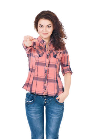 Happy smiling young woman or teenage girl pointing finger to you. Teen girl pointing at camera choosing you, isolated on white background. Portrait of beautiful female - gesture and people concept.の写真素材