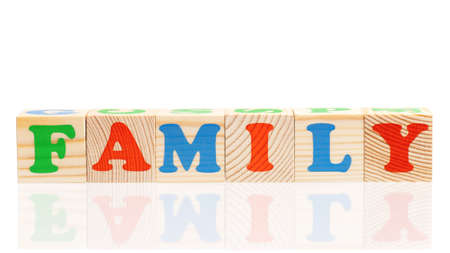 Family word formed by colorful wooden alphabet blocks, isolated on white backgroundの写真素材