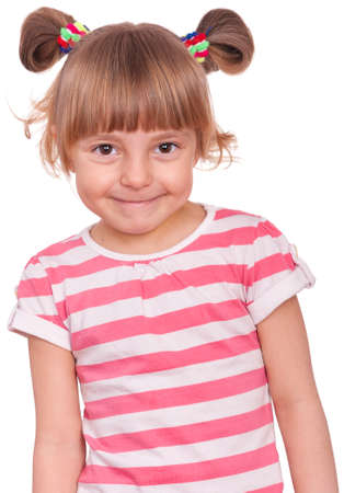 Emotional portrait of a 5 years old girl, laughing. Cute caucasian baby isolated on white background. Beautiful preschool child posing in studio. Healthy carefree kid playing indoors.の写真素材