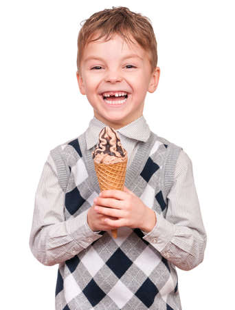 Portrait of cheerful little boy with ice cream cone. Close-up of child eating ice-cream with chocolate, isolated on white background.の写真素材