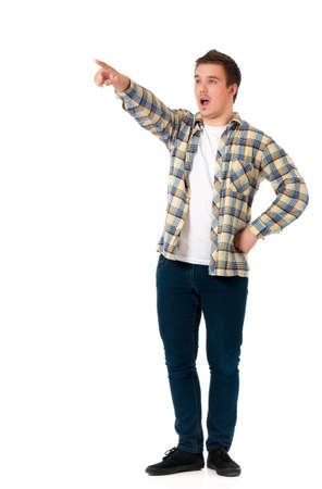 Full length portrait of a successful young man showing something, isolated on white backgroundの写真素材