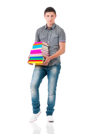 Full length portrait of a caucasian guy student of college or university with book. Casual young male isolated white background. Teen boy look at camera, walking and holding books.の写真素材
