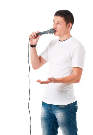 Young modern man with microphone isolated on white backgroundの写真素材