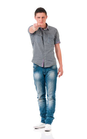 Teen boy pointing at camera choosing you, isolated on white background. Caucasian young man pointing finger to you.の写真素材
