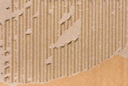 Close up of side view of a textured recycled packing cardboard with natural fiber partsの写真素材
