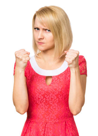Portrait of woman with beautiful face, isolated on white background. Young cute girl showing different emotions - angry is ready to fight, shakes her fists.の写真素材