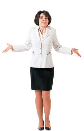 Young female gesturing do not know sign, isolated on white background. Business woman in suit looking at camera.の写真素材