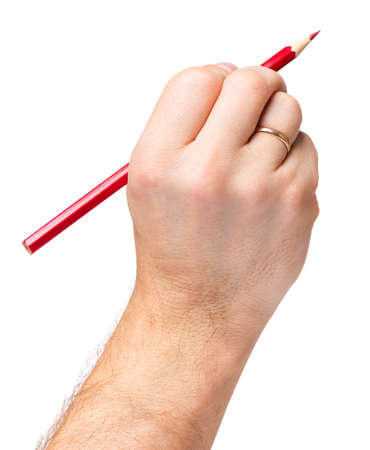 Male hand holding red pencil, isolated on white background.の写真素材