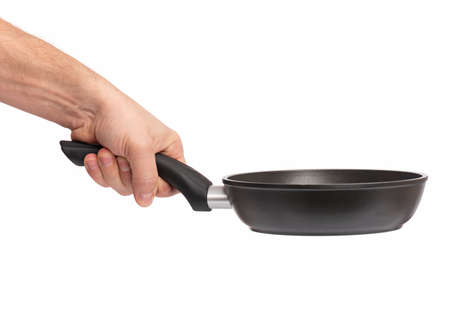 Male hand holding simple new empty Non-stick Frying Pan with black handle, isolated on white background.の写真素材