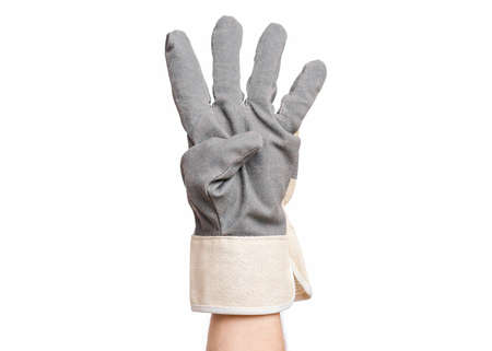Worker showing four fingers up gesture. Male hand wearing working glove, isolated on white background.の写真素材