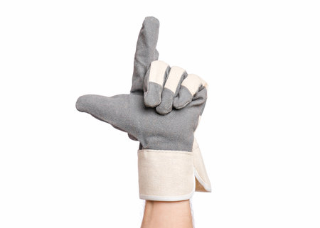 Worker showing gesture - two fingers, gun sign. Male hand wearing working glove with, isolated on...