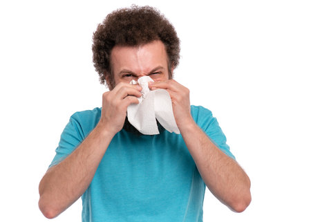 Crazy bearded Man with funny Curly Hair has a runny nose, isolated on white background. Sick guy...