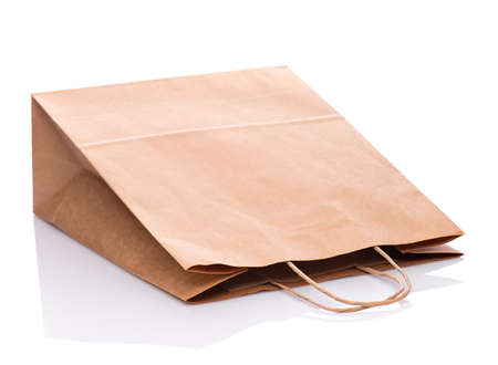 One Empty Brown Paper Bag. Recycled paper Shopping Bag isolated on white background.の写真素材