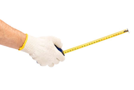 Male Hand wearing Working cotton Glove with Tape-measure. Human Hand holding Tape measure, Isolated on White Background.の写真素材