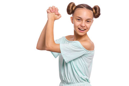 Portrait of teen girl happy and excited expressing winning gesture. Successful and celebrating victory, triumphant child making win sign. Beautiful caucasian teenager, isolated on white background.の写真素材