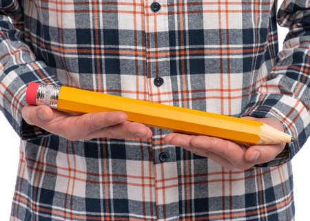 Man hands is holding big pencil. Back to school and education concept.の写真素材