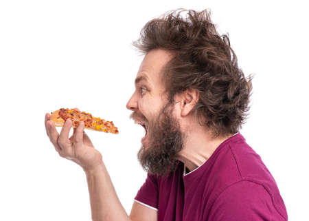 Crazy Bearded Man with funny Haircut. Happy Hungry man Eating Pizza, isolated on white background.の写真素材