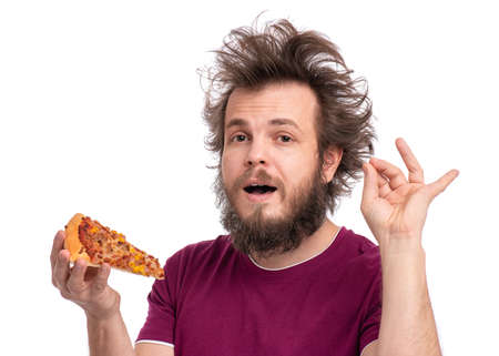 Crazy Bearded Man with funny Haircut gesturing excellent. Happy Hungry man Eating Pizza and showing sign for delicious, isolated on white background.の写真素材