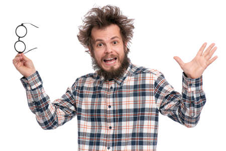 Crazy bearded Man with funny Haircut in Eyeglasses, isolated on white background. Happy Surprised guy in plaid shirt - screaming and keeping mouth open. Emotions and signs concept.の写真素材