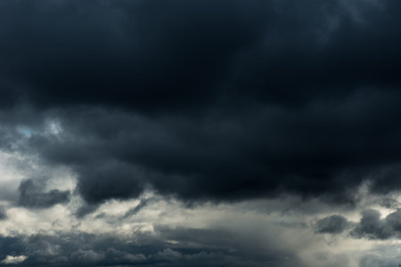 Beautiful grey Fluffy Rain Clouds. Cloudscape after bad weather. Autumn dark Storm Clouds over Black...